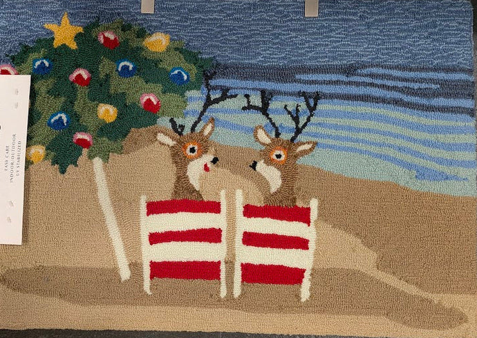 Decorative rug with reindeer and Christmas tree design on a dark surface