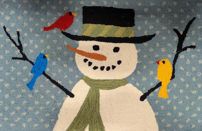 Decorative rug with a snowman design and birds on a blue background